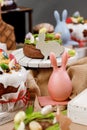 Easter cake orthodox sweet bread kulich and colorful chocolate eggs on festive table Royalty Free Stock Photo