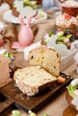 Easter cake orthodox sweet bread kulich and colorful chocolate eggs on festive table Royalty Free Stock Photo