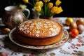 Easter cake on plate with eggs and tulips Royalty Free Stock Photo