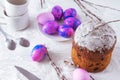 Easter cake with purple eggs and willow branches side look white cups table cloth