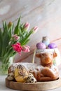 Easter cake in the shape of a lamb with Easter eggs and spring flowers on the table Royalty Free Stock Photo