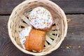 Easter cake in a straw basket on a table outdoors close up, Easter holiday Royalty Free Stock Photo