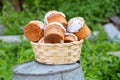 Easter cake in a straw basket on a table outdoors close up, Easter holiday Royalty Free Stock Photo