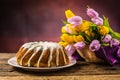 Easter Cake. Traditional ring marble cake withe easter decotation. Easter eggs and spring tulips. Royalty Free Stock Photo