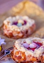 Easter sponge cake nest. Nuts and oval sweet sweets in the form of eggs. Blurred background. Shallow depth of field. Toned image. Royalty Free Stock Photo