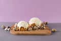 easter cakes covered with white glaze quail eggs on a wooden cutting board side view easter still life Royalty Free Stock Photo