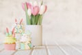 Easter cakes, cupcakes, eggs and gingerbread cookies on white wooden table. 3d render