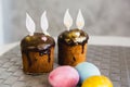 Easter Cakes decorated with bunny ears and colorful eggs. Traditional Kulich, Paska Easter Bread