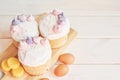 Easter cakes, eggs and macaroons on the table. Easter card template with place for text. Homemade pasques.Easter sweets on a white Royalty Free Stock Photo