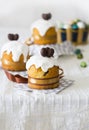 Easter cakes with sugar glaze or icing, chocolate eggs