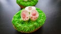 Easter Cakes. Symbolize The Easter Bunny, Which Is Hidden In The Grass, And Outside Protrude Paws And Tail