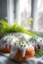 Easter cakes with white glaze and spring decorations by the window. Ideal for culinary and festive content. - AI Generated