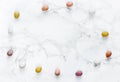 Easter candy eggs frame on white marble background Royalty Free Stock Photo
