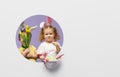 Easter card. Cute little children with bunny ears holding basket of Easter eggs. Child in a round hole Royalty Free Stock Photo