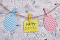 Easter card and paper eggs on rope. Royalty Free Stock Photo