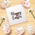 Easter Card with realistic eggs and daisy flower on wood texture background