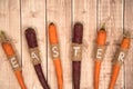 Easter carrots on a wooden background.