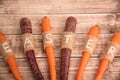 Easter carrots on a wooden background in rustic style