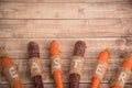 Easter carrots on a wooden background in rustic style