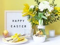 Easter celebration card close up with colored eggs in the bowl and a felt board Royalty Free Stock Photo