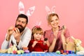 Mother, father and daughter preparing for Easter Royalty Free Stock Photo