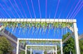 Easter celebration decoration made of bright ribbons, eggs and flowers in front of deep blue sky