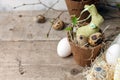 Easter celebration table setting, stylized photo - eggs and decorative bunny rabbit on vintage wooden background, spring holiday,