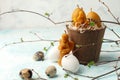 Easter celebration table setting, stylized photo - eggs and decorative natural wax candles - angel, rabbit, egg on light