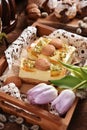 Easter cheesecake with peach and passion fruit on festive table