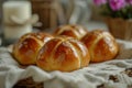 Easter cheesy hot cross buns on tea towel with jug of flowers in country kitchen