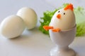 Easter chicken made of hard boiled egg in egg cup, funny appetizer easter Royalty Free Stock Photo