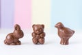 Easter chocolate bunny and teddy bear and bird on white