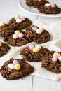 Easter chocolate cookies. Nests with sweet eggs on white background