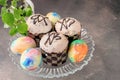 Easter chocolate cupcakes with colored eggs. Easter cupcakes with vanilla frosting, candy eggs and sprinkles, holiday Royalty Free Stock Photo