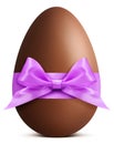 Easter chocolate egg with purple ribbon bow Royalty Free Stock Photo