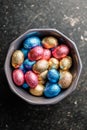 Easter chocolate eggs wrapped in aluminium foil in bowl. Top view Royalty Free Stock Photo