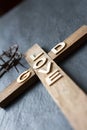 Easter christian wooden cross with an inscription god is love abstract religion background Royalty Free Stock Photo