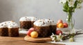 Easter colomba pasquale and colorful easter eggs with spring blossoms on wooden table Royalty Free Stock Photo
