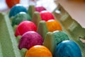 Easter colored eggs in a cardboard box Royalty Free Stock Photo