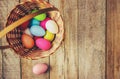 Easter colored krashenki on a wooden background.