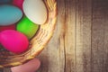 Easter colored krashenki on a wooden background.