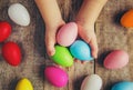 Easter colored krashenki on a wooden background.