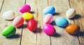 Easter colored krashenki on a wooden background.