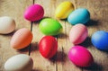 Easter colored krashenki on a wooden background.