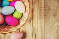 Easter colored krashenki on a wooden background.