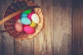 Easter colored krashenki on a wooden background.