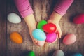 Easter colored krashenki on a wooden background.