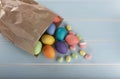 Easter colorful dyed chicken eggs in a paper bag