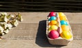 Easter colorful eggs with a branch of a blossoming apple tree on a wooden background. Royalty Free Stock Photo