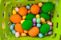 Easter colorful eggs of different sizes in a basket Royalty Free Stock Photo